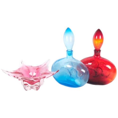 299 - A pair of Art glass decanters and stoppers, 34cm, and a star-shaped cranberry glass dish