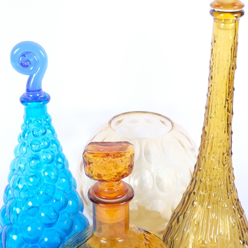 300 - A 1960s moulded amber glass decanter and stopper, 55cm, 2 smaller decanters, and an Art glass bowl