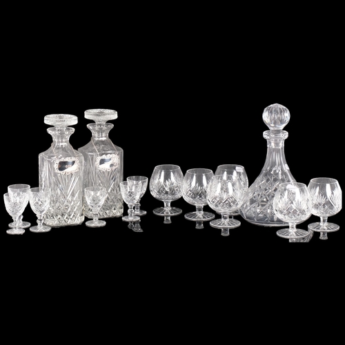 303 - A pair of cut-crystal decanters and stoppers, with plated labels, 24cm, Brandy and liqueur glasses, ... 