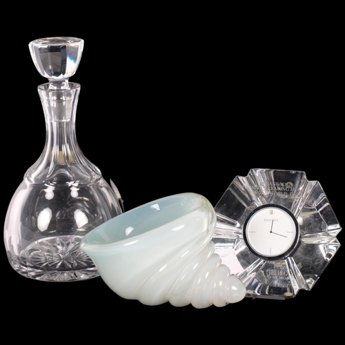 309 - An Orrefors glass clock, a crystal decanter and stopper, 25cm, and a shell design glass vase (cracke... 