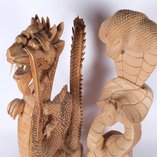 387 - 2 large carved wood figures, depicting a dragon and a cobra, H66cm