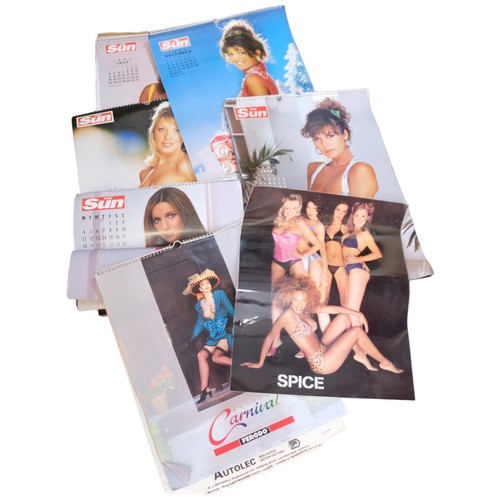 183 - A group of Pirelli calendars from the 1980s, and a quantity of calendars associated with The Sun New... 