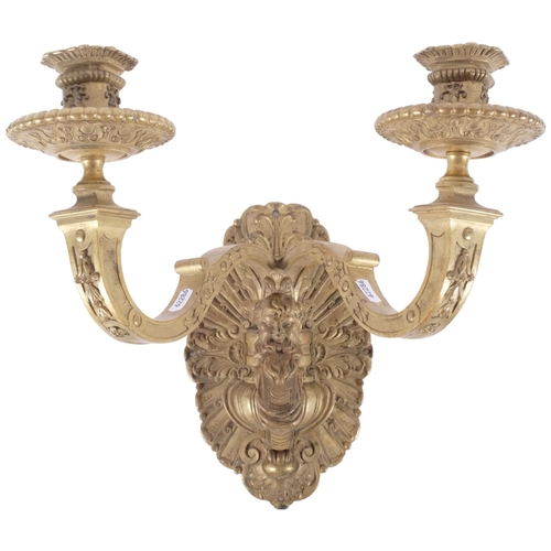 522 - A large heavy gilt-metal double wall sconce, with bearded man decoration, H38cm