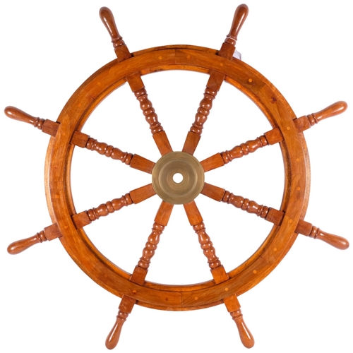 547 - A large reproduction ship's wheel, diameter approx 88cm