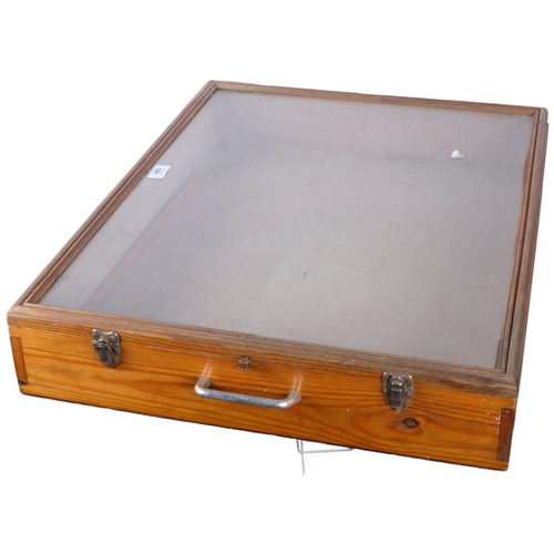 550 - A large table-top glass panelled display case, 67cm x 53cm