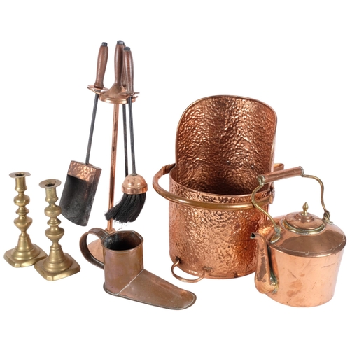 553 - An Antique copper ale warmer, a pair of brass candlesticks, an Antique copper kettle, unmarked, an A... 