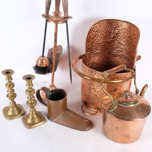 553 - An Antique copper ale warmer, a pair of brass candlesticks, an Antique copper kettle, unmarked, an A... 