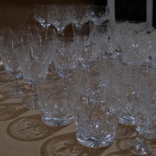 564 - A large suite of cut-glass, including red and white wine glasses, tumblers, Sherry glasses etc