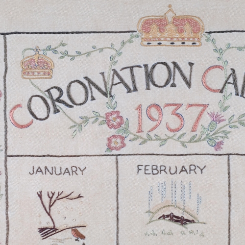 577 - A 1937 Coronation calendar needlework, in the form of a fire screen, wooden frame with glass panel, ... 