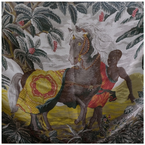 584 - A large woolwork tapestry wall hanging with tab top, depicting a horse and rider in foliate surround... 