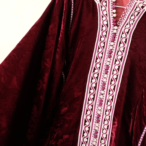 588 - A Moroccan red velvet caftan, with applied braided edging