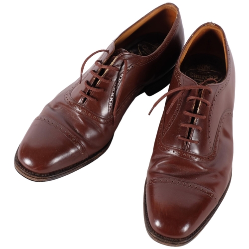 589 - A pair of gent's brown leather semi-brogue Oxford shoes, by Church's, leather uppers and leather sol... 