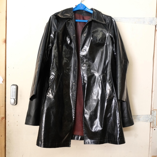 590 - A Vera Pelle gentleman's black leather jacket, size XL?, and a lady's black rain mac, size 12 (2)