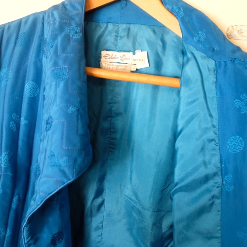 592 - EDDIE LAU - a lady's 100% blue silk jacket, size 14