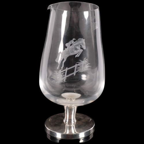 695 - A large glass wine flagon on sterling silver base, with engraved horse and rider, height 25cm