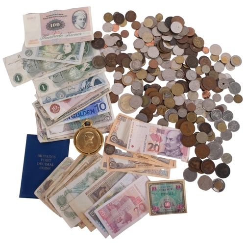 704 - A quantity of UK and worldwide banknotes, UK pre-decimal coins, etc