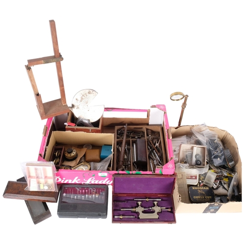 712 - 2 boxes of various watchmaker's tools, including pivoting tool, revolving screwdriver stands, pliers... 