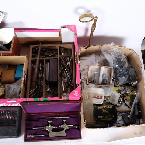 712 - 2 boxes of various watchmaker's tools, including pivoting tool, revolving screwdriver stands, pliers... 