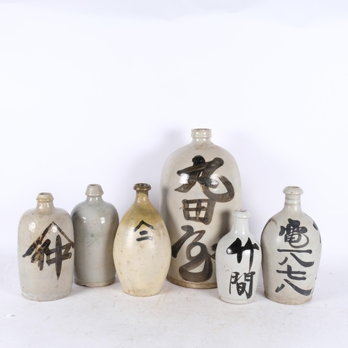 727 - A group of 6 Sake bottles, various sizes, largest 40cm