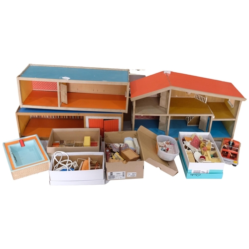 737 - LUNDBY A large mid-century hand-built wooden doll's house, 3 separate sections including garage and ... 