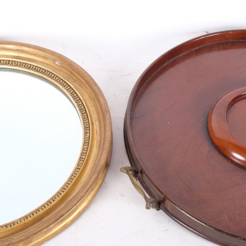 744 - A circular gilt-framed wall mirror, diameter 40cm, and an Edwardian mahogany circular 2-handled tea ... 