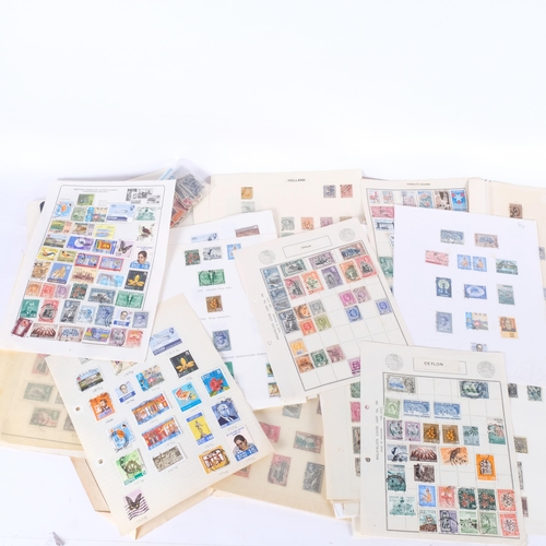 745 - A collection of worldwide postage stamps, loose stock book sheets, including many from Persia, Hong ... 