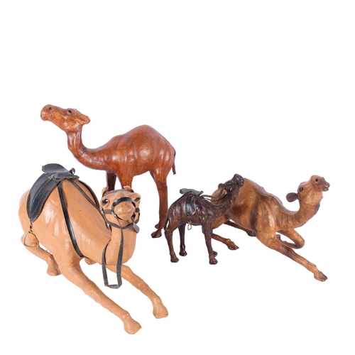 772 - A group of leather clad camels, longest 45cm (4)