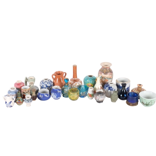 779 - A collection of miniature Chinese and Japanese pots, etc