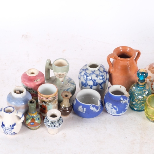 779 - A collection of miniature Chinese and Japanese pots, etc