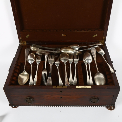 853 - An early 20th century oak cutlery canteen with fitted drawer, and a small quantity of Old English pa... 