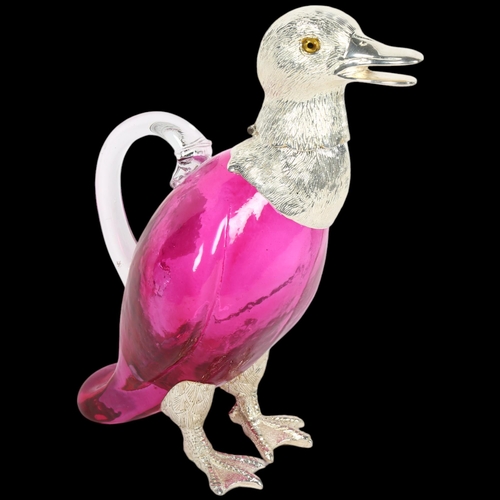 859 - A Claret jug in the form of a duck, with plated mounts and red glass body, H26cm