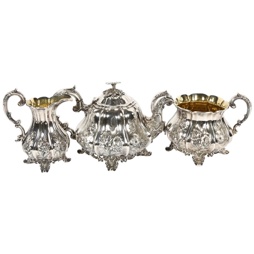 863 - An ornate Rococo style silver plated 3-piece tea set