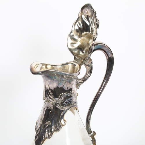 866 - A French Claret jug, with embossed silver plated mounts and clear glass body, impressed France to th... 