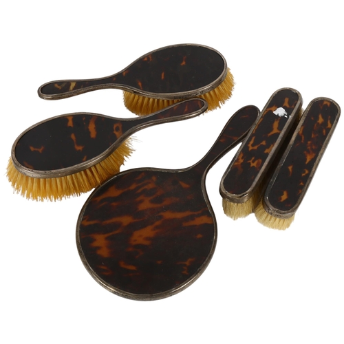 868 - A George V silver and tortoiseshell 4-piece dressing table brush and mirror set, hallmarks for Londo... 