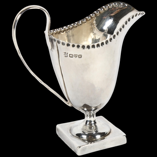 895 - An Edward VII silver cream jug, hallmarks for Chester 1908, maker's marks for Nathan & Hughes, H10cm