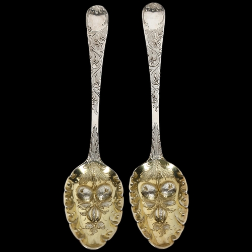 900 - A pair of George III silver berry spoons with gilded bowls, maker's marks for George Smith (III), ha... 