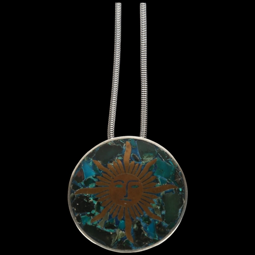 907 - ANTONIO TAXCO - a large Mexican brass and composite stone inlaid sterling silver sun pendant necklac... 