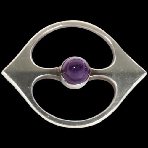 911 - HANS HANSEN - a Danish modernist sterling silver amethyst openwork eye brooch, 46.5mm, 13.3g