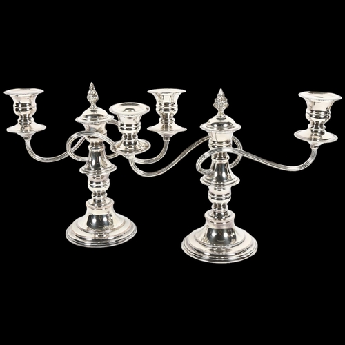 915 - A pair of silver plate on copper 3-branch table candelabras, with snuffer, H23cm