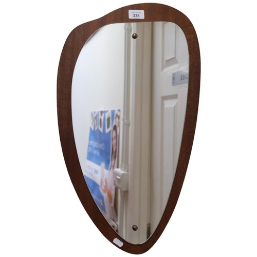 338 - A retro wall mirror mounted on wooden panel, H60cm