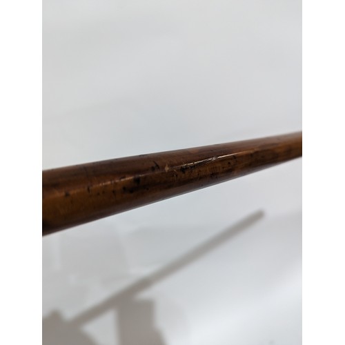 56 - An 18th century Malacca cane with a gilt-metal top engraved with swags and 2 eyelets to the shaft. L... 