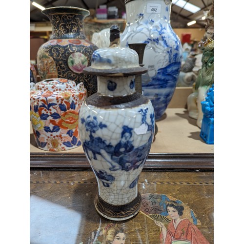 394 - A Chinese crackle glaze blue and white jar and cover, with 4 character mark, H22cm, and a Chinese va... 