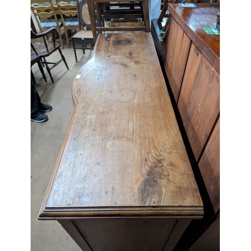 2134 - A mahogany Art Nouveau style sideboard, with four drawers, three cupboards and carved foliate decora... 