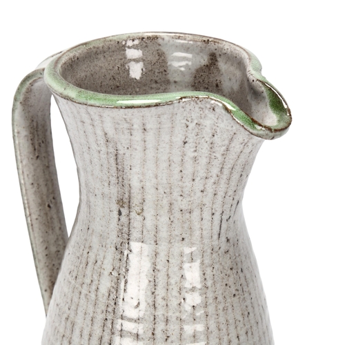 103 - DAVID LEACH (1911-2005), British, a grey and green glaze jug with sgraffito lines, makers mark to ba... 