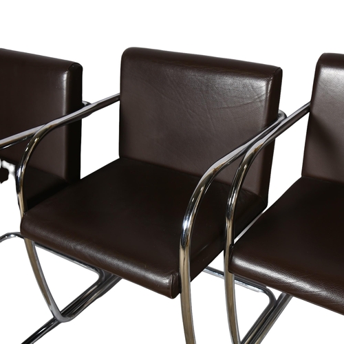 107 - A set of 4 cantilever dining chairs, in the style of Mies Van Der Rohe, tubular steel frames and bro... 