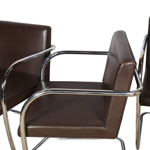 107 - A set of 4 cantilever dining chairs, in the style of Mies Van Der Rohe, tubular steel frames and bro... 