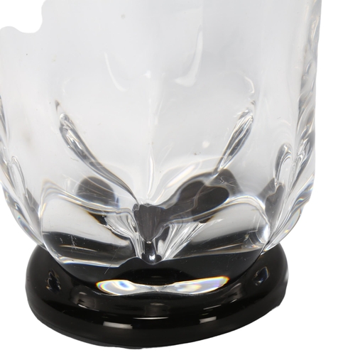 132 - EDWARD HALD for Orrefors, Sweden, a 1930s clear lobed glass vase with black foot, marked to base OF ... 