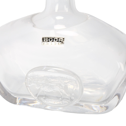 135 - ERIK HOGLUND for Boda, a stoppered clear glass flask, with applied Bull seal, signed Boda, with orig... 