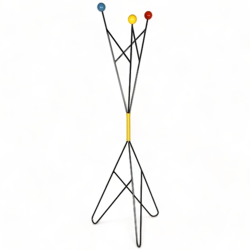 140 - ROGER FERAUD, France, a mid-century coat stand in wrought iron with coloured wooden ball terminals, ... 