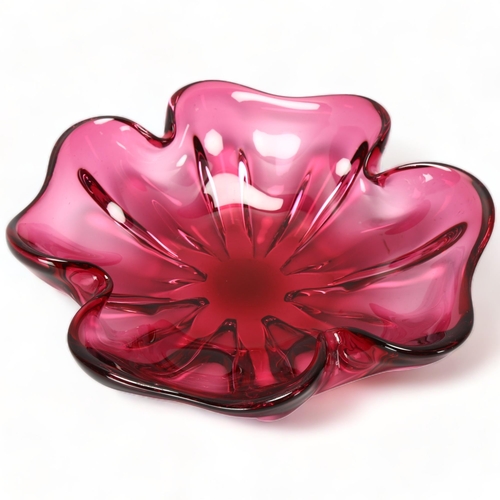 150 - A mid 20th century studio glass bowl, cranberry glass in flower form with polished pontil, diameter ... 